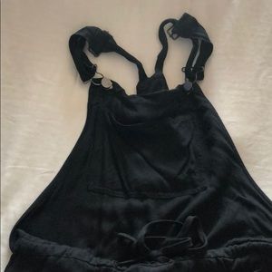 Overalls..black pants elastic at the ankles.